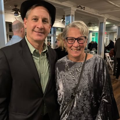 Two people attending a Quinn & Wilson community gathering