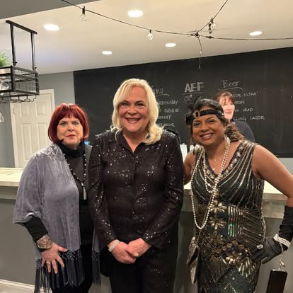 Three people from a Quinn & Wilson community event